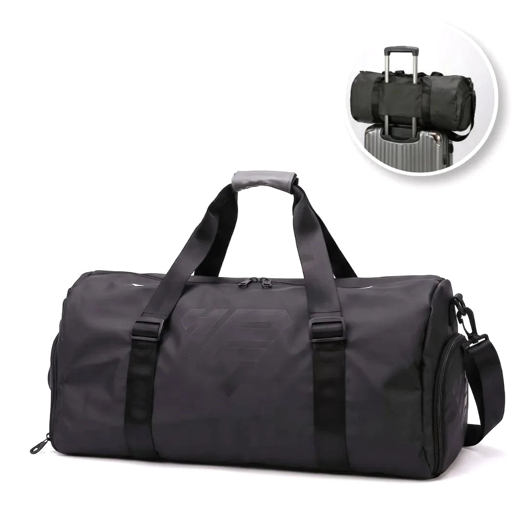 GymRoam 30L Duffle Bag in black, side view, with an inset showing it strapped to a rolling suitcase