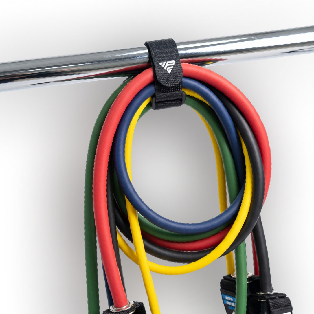Clinch Band Storage Strap hanging a coiled set of HomeProGym Resistance Bands from a chrome bar