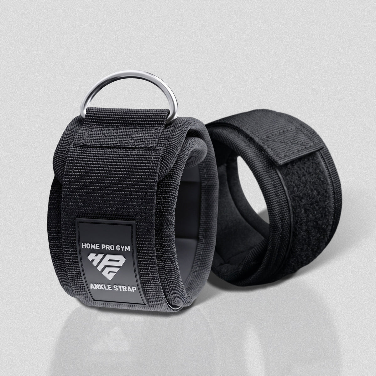 Pair of Ankle Straps standing upright, one showing the padded inner lining.