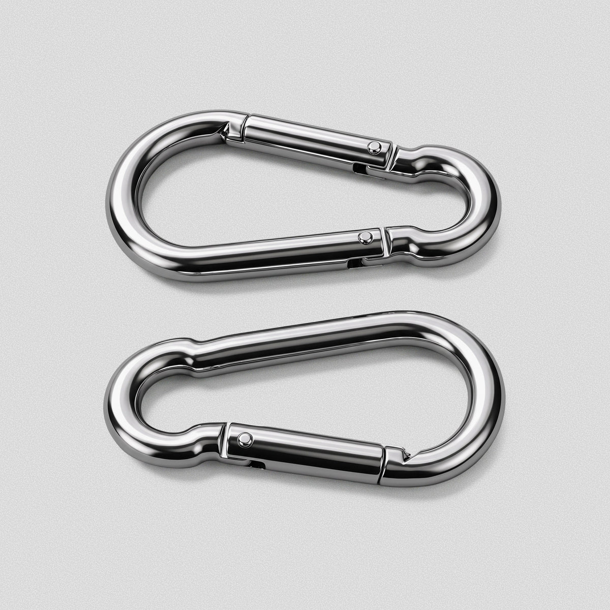 Two HomeProGym steel carabiners side by side, gates and hinge pins visible.