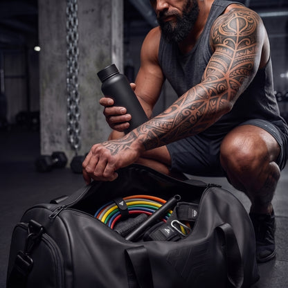 GymRoam 30L Duffle Bag open on a gym floor with the full band set and bar packed inside.