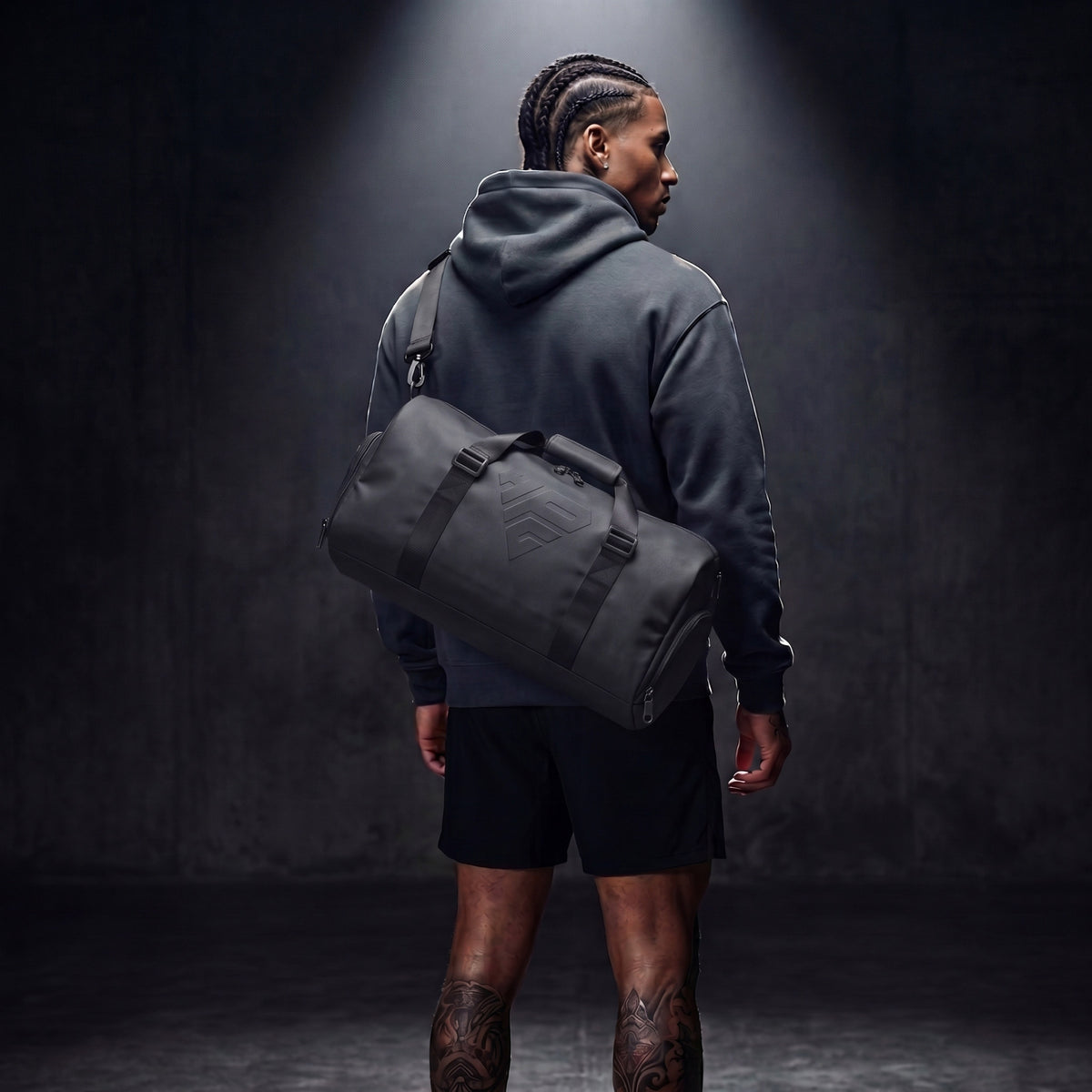 GymRoam 30L Duffle Bag carried on the shoulder by the strap, seen from behind.