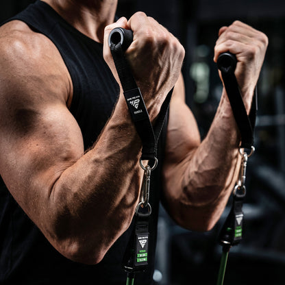Bicep curl with both Premium Handles, bands under tension from the floor.