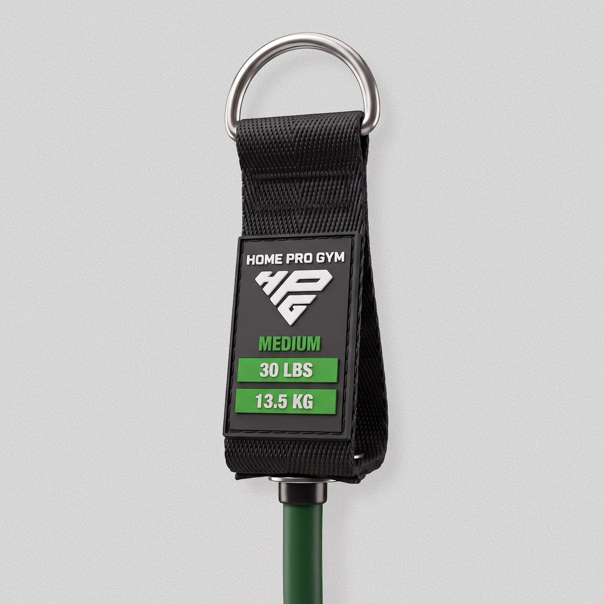 Handle tag on the HomeProGym green resistance band: Medium, 30 lbs, 13.5 kg.