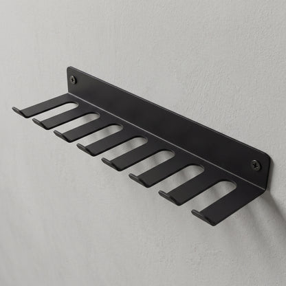 Storage Rack screwed to a wall, hooks facing out.
