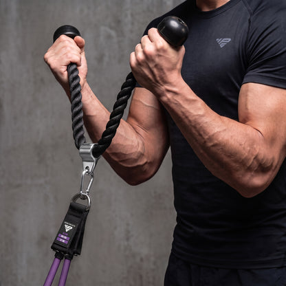 Rope curl with the Tricep Rope, band clipped to the steel ring and anchored under the feet.