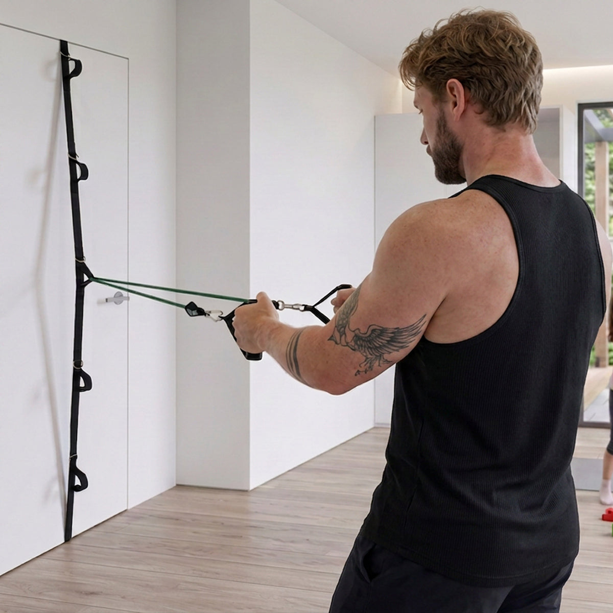Standing row with a band clipped to the Ultra Door Anchor at chest height on a closed door.