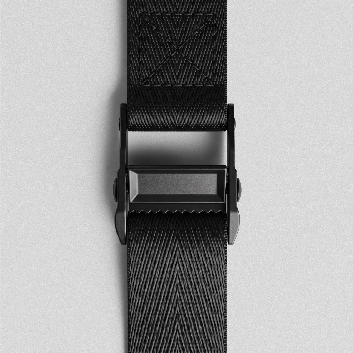 Ultra Door Anchor cam buckle from above with the strap threaded through.