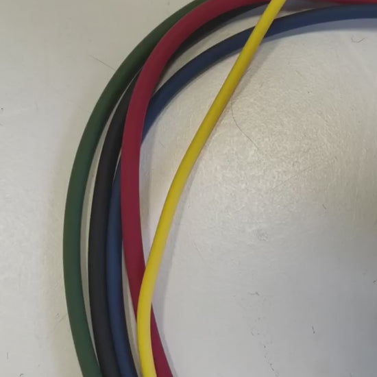 Video: hands bundling HomeProGym Resistance Bands and closing a Clinch Band Storage Strap around them