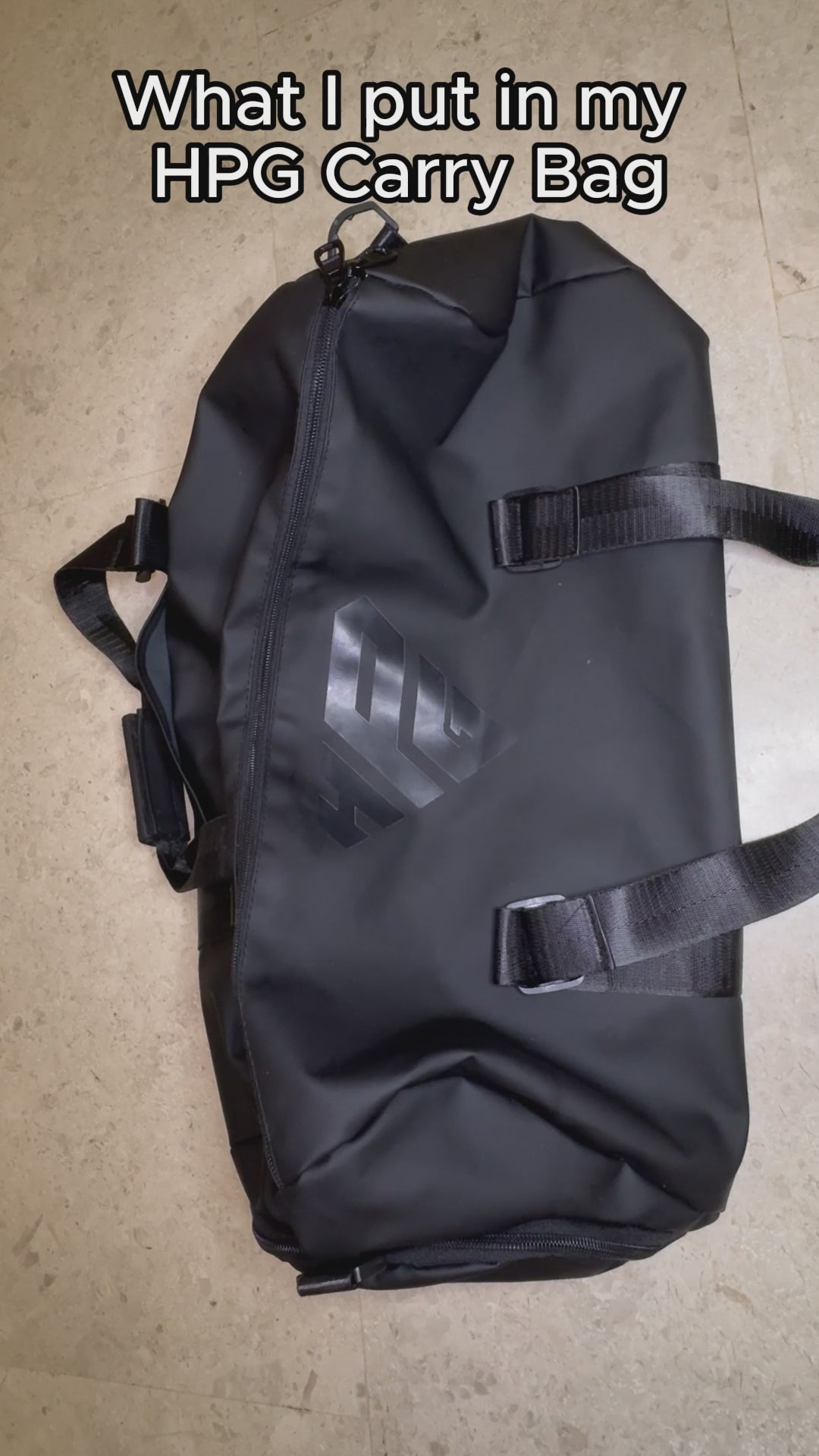 Video: hands packing the GymRoam 30L Duffle Bag and opening its side compartment