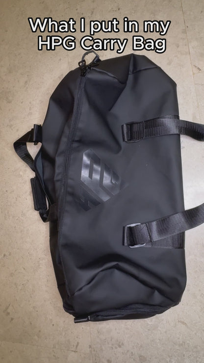 Video: hands packing the GymRoam 30L Duffle Bag and opening its side compartment