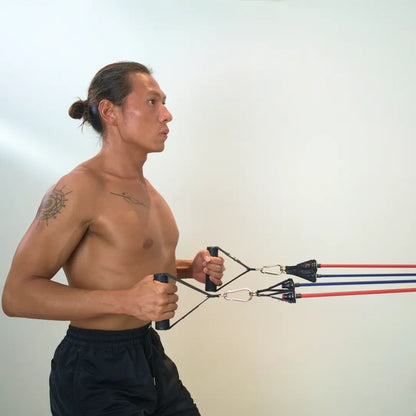 Man performing back rows exercise with HomeProGym PowerTube stackable resistance bands at home