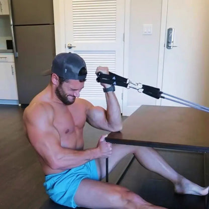Man performing concentration curls exercise with HomeProGym PowerTube stackable resistance bands at home