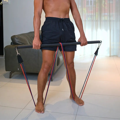Man performing deadlift exercise with HomeProGym PowerTube stackable resistance bands attached in a W to the HomeProGym bar at home